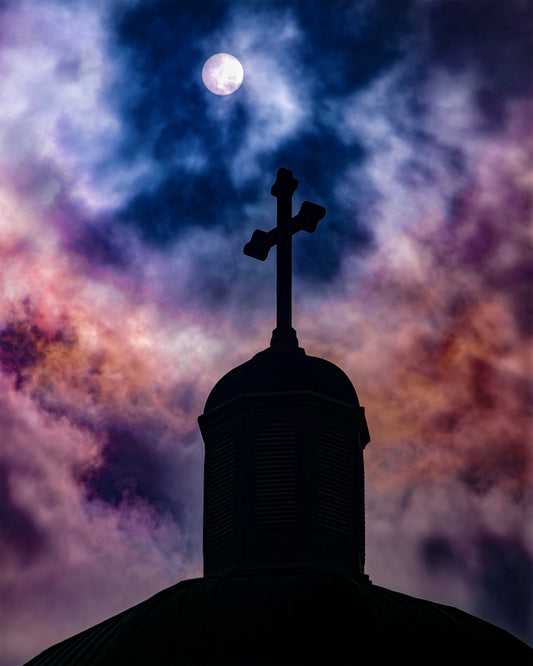 photo of church steeple with ominous clouds