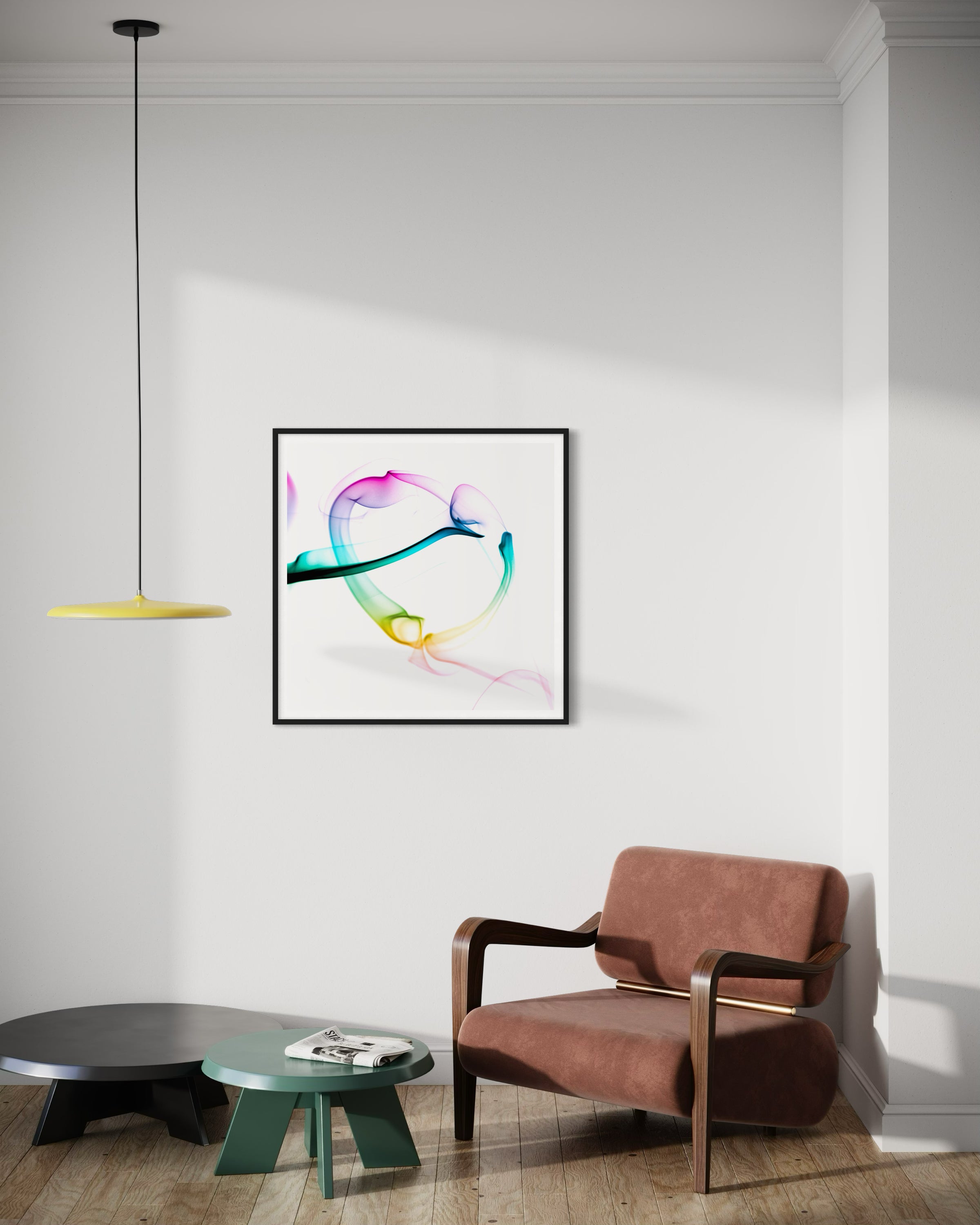 abstract heart in pink, green, gold, teal, red on white background in black frame on light gray wall in modern residential sitting room