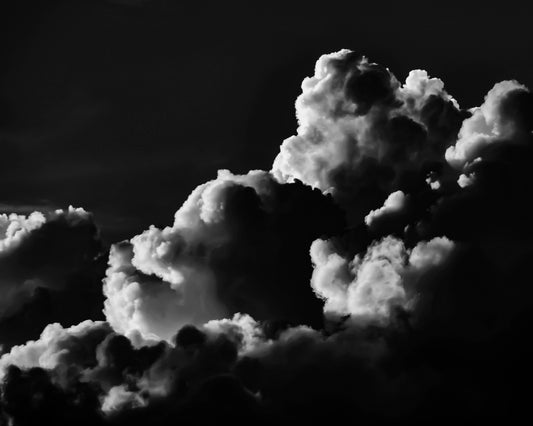 black and white photo of clouds, one looks like a dog's head in profile