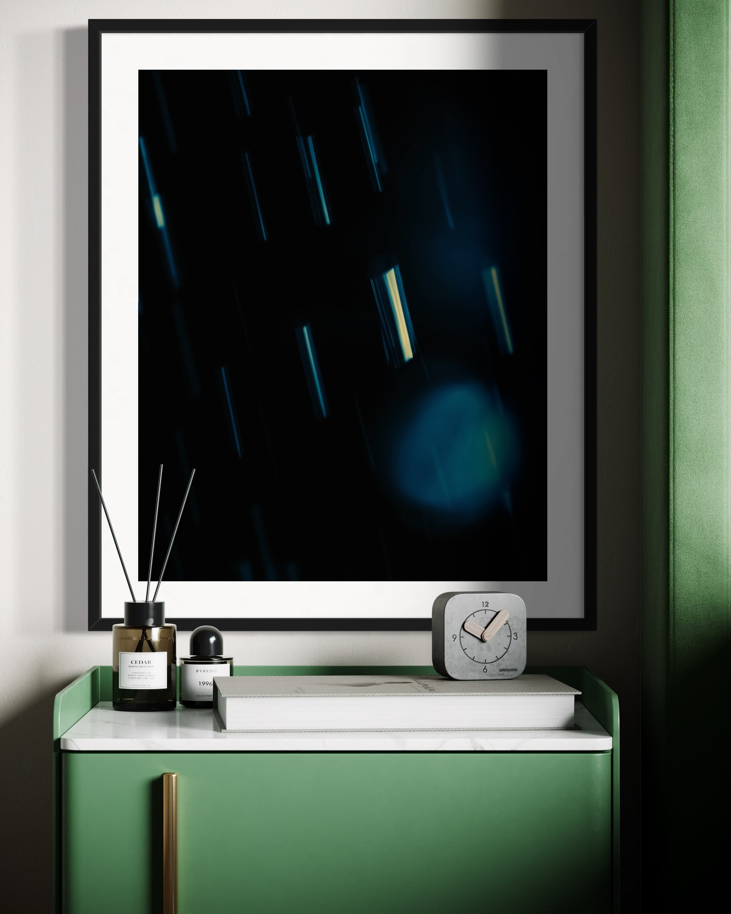 close up cool toned photo of streaks of rain in black frame with white matte on white wall above modern lime green small table