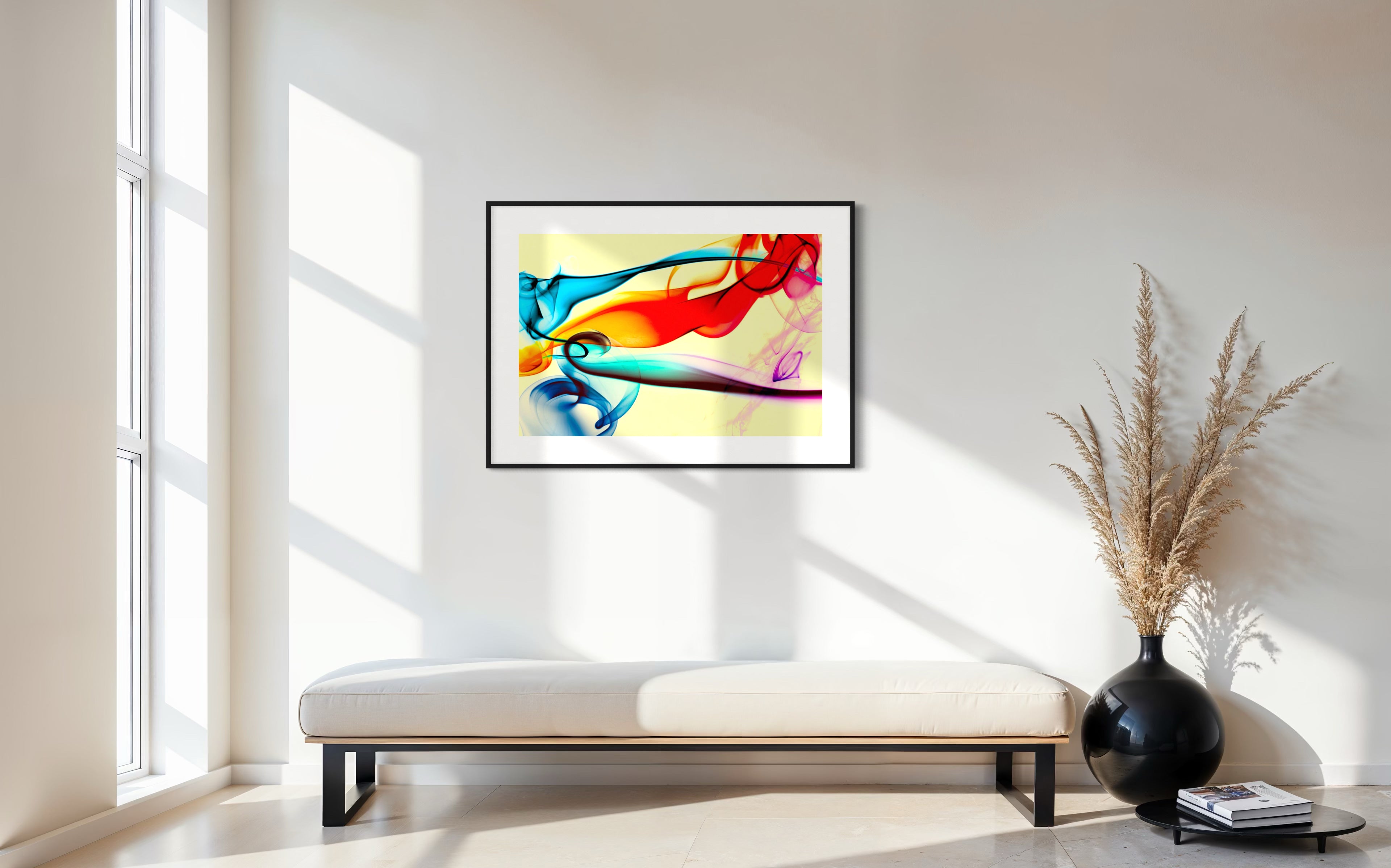 swirls of blue, yellow, orange, teal, purple and red on light yellow background in black frame with white matte on white  wall in minimalist sitting area with long modern bench