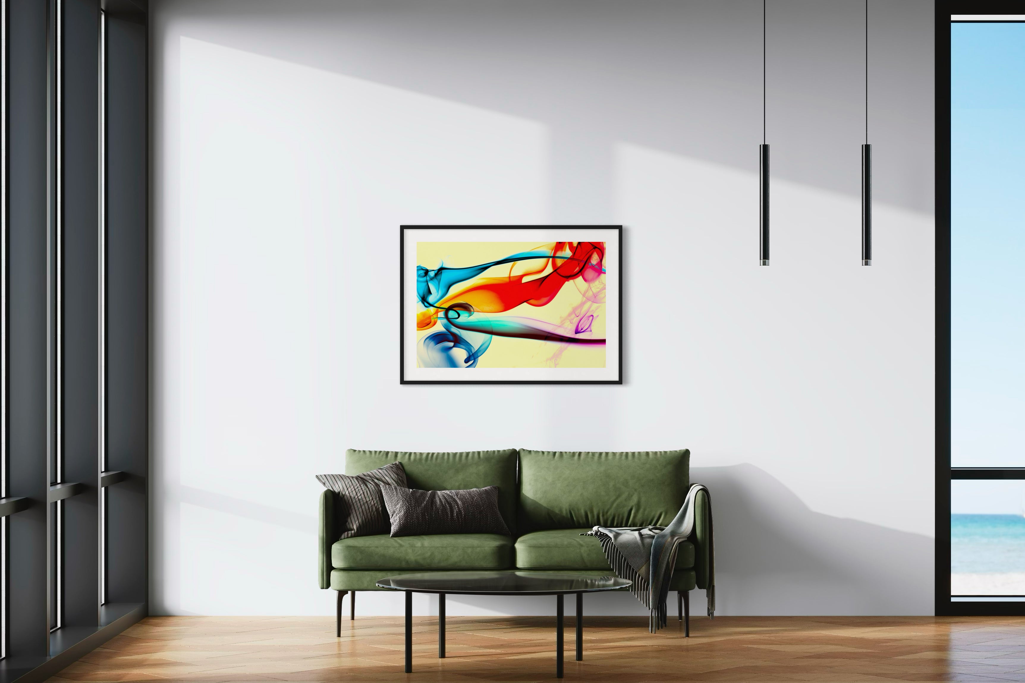 swirls of blue, yellow, orange, teal, purple and red on light yellow background in black frame with off white matte on light tan wall in minimalist sitting area with green couch