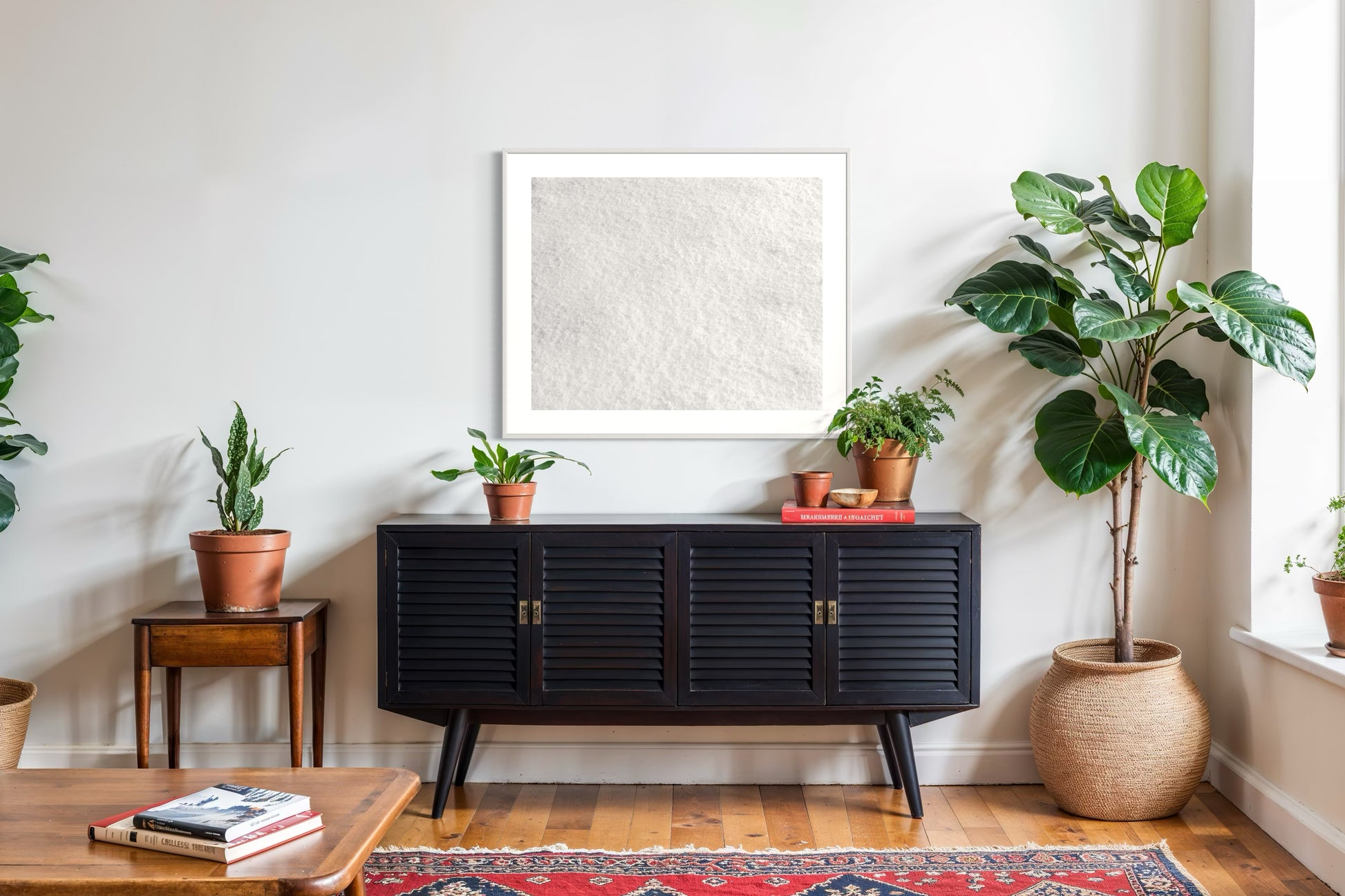 Close up photo of fresh white clean snow in white frame with white matte on above black piece of furniture in country style living room