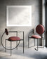 Close up photo of fresh white clean snow in white frame with white matte gray wall in minimalist industrial style hone with 2 very modern chairs with keep pink cushions