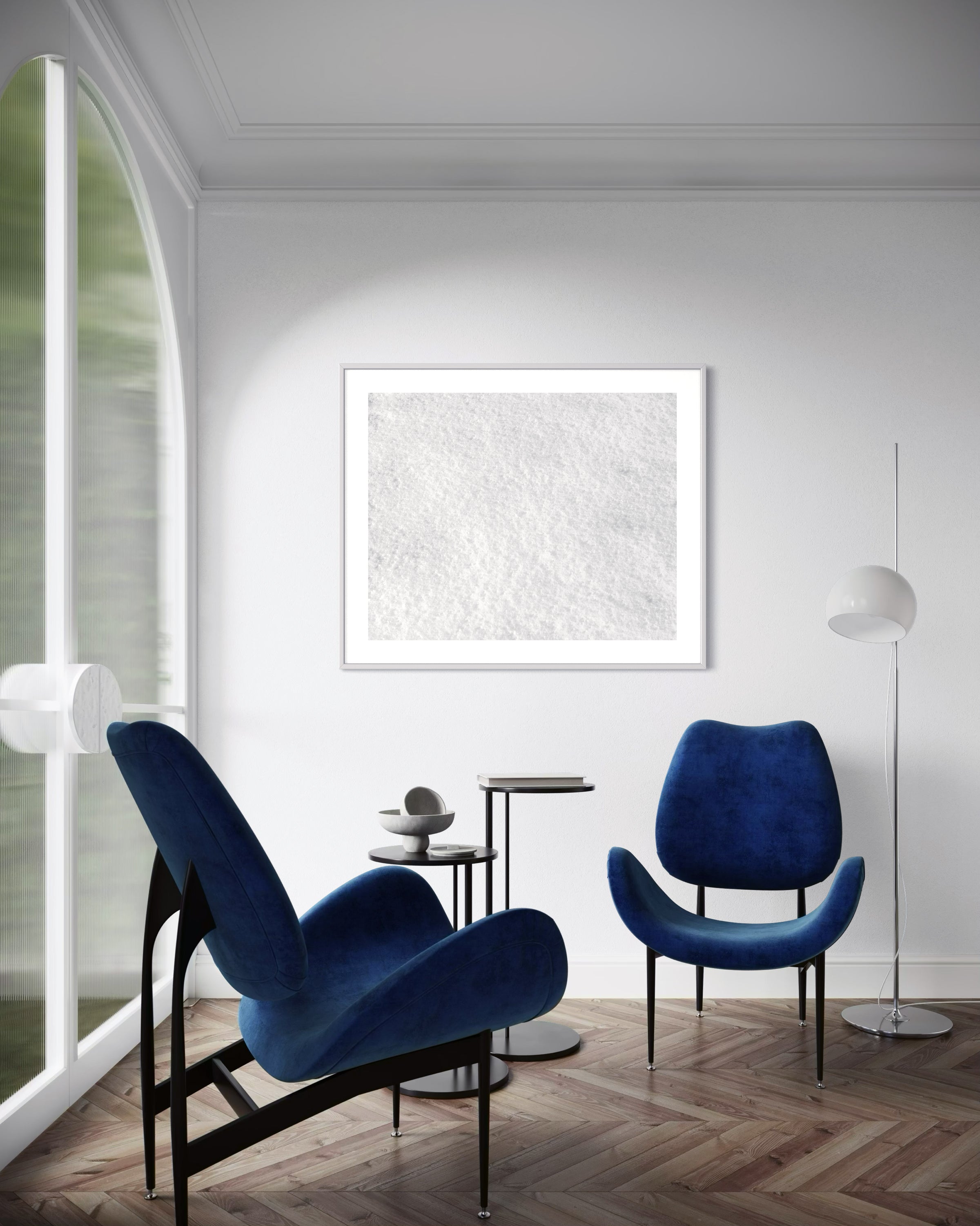 Close up photo of fresh white clean snow in white frame with white matte in modern sitting room with two blue chairs on hardwood floor