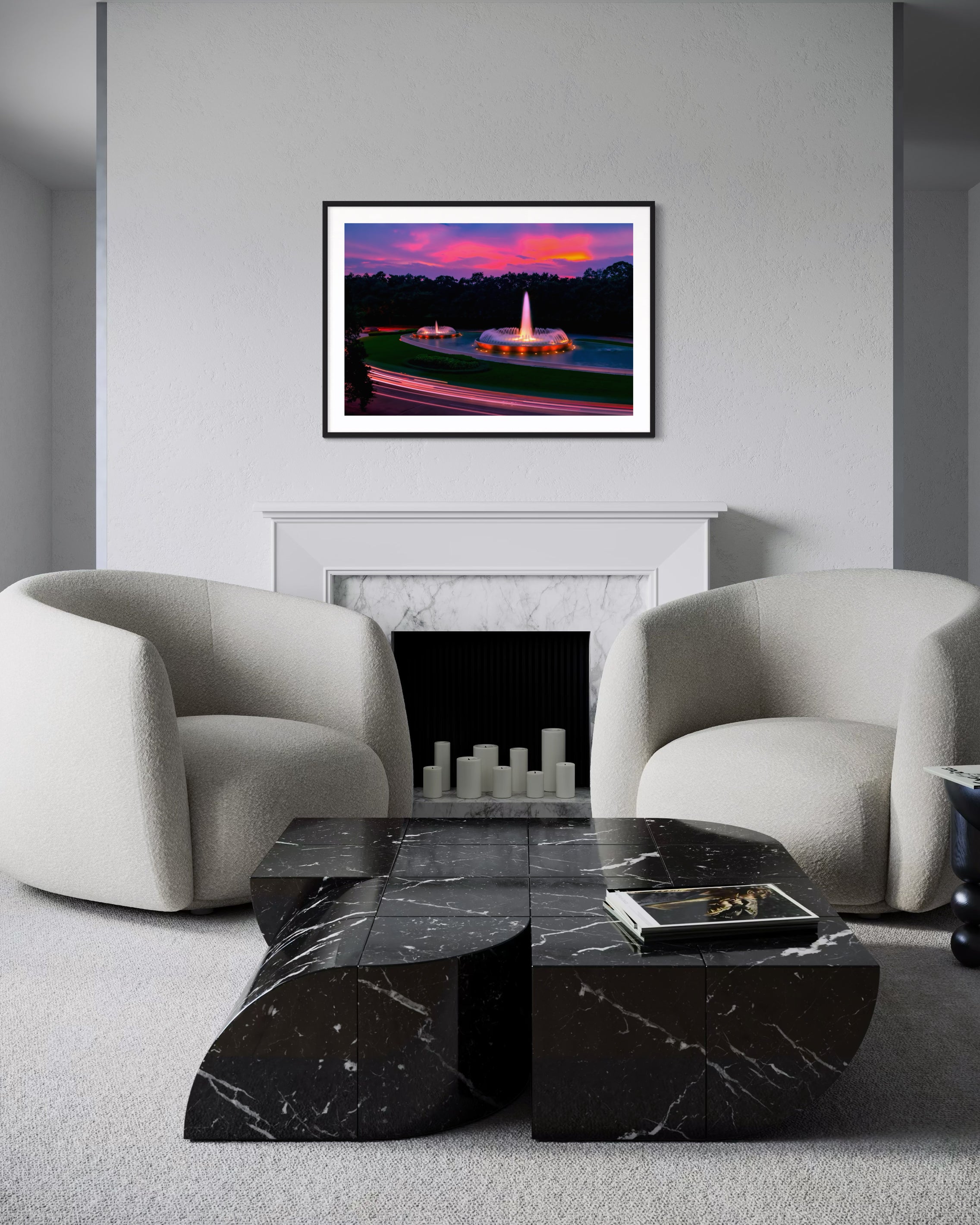 photo of Mecom Fountain in Houston shot at sunset with blurred car lights at the bottom in black frame with white matte on white wall above fireplace in living room with white tones and marble coffee table
