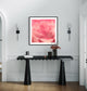 macro of pink rose shot in studio with shallow depth of field in black frame with white matte on white wall above black modern small table in a minimalist residence 
