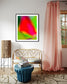 photo of blurry red leaf on blurred bright green background in black frame on white wall in living room rustic country sitting room