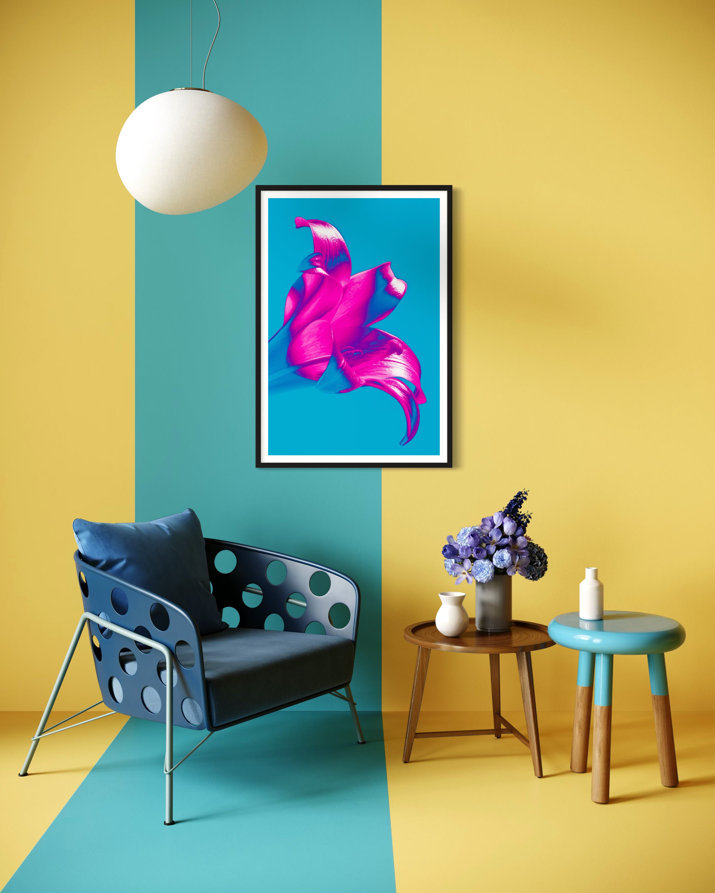 bright pop art photo of pink lily on blue background in black frame with white matte on wall in blue and yellow stripedl sitting room with blue chair room