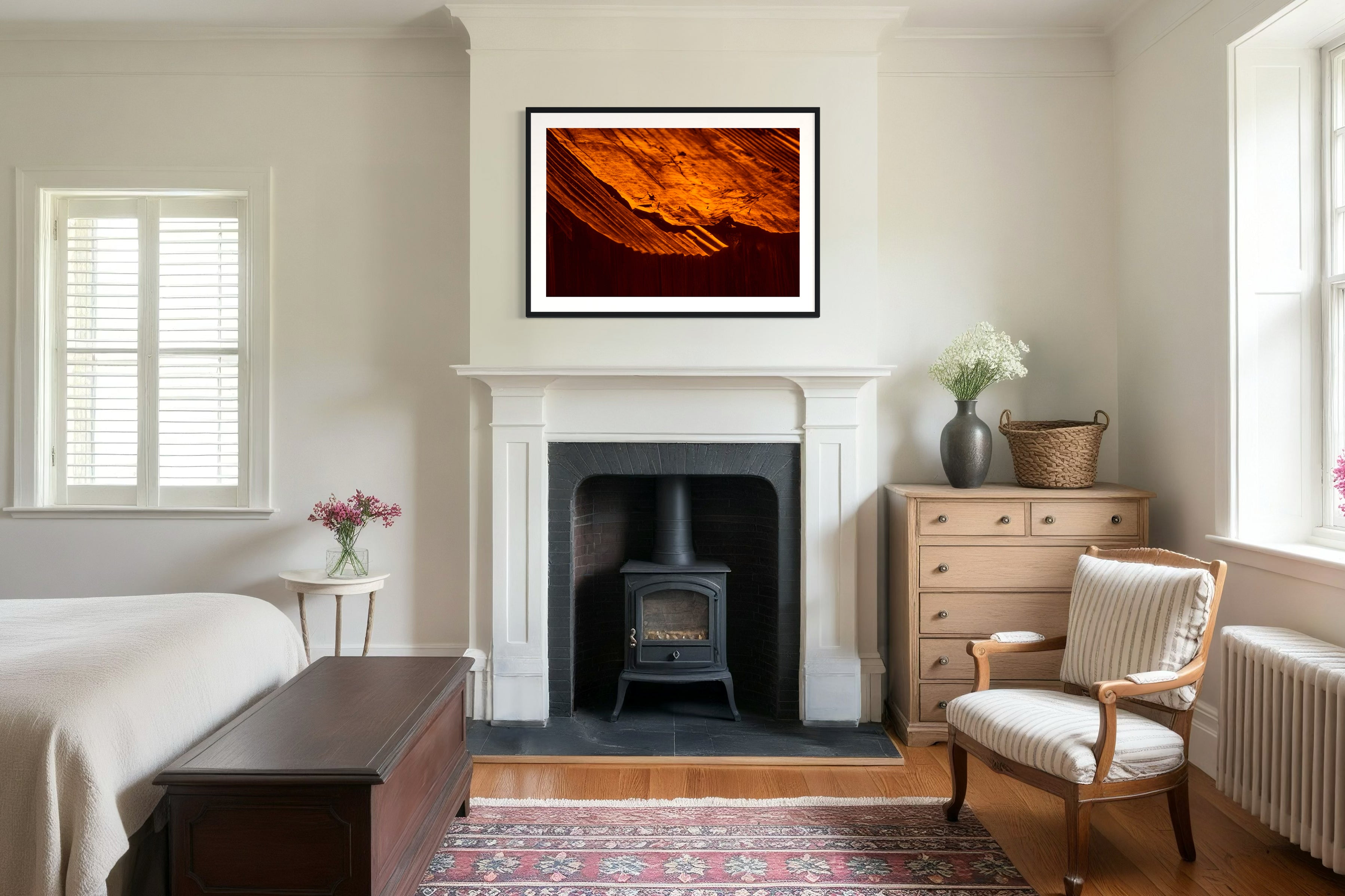 rusty old metal roof on old barn with warm tones photo in black frame on wall in modern rustic bedroom with potbelly stove