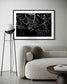 close up photo of rain drops on spider web in black and white in black frame with white matte on white wall in modern minimalist living room