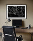 close up photo of rain drops on spider web in black and white in black frame with white matte on tan wall in modern home office