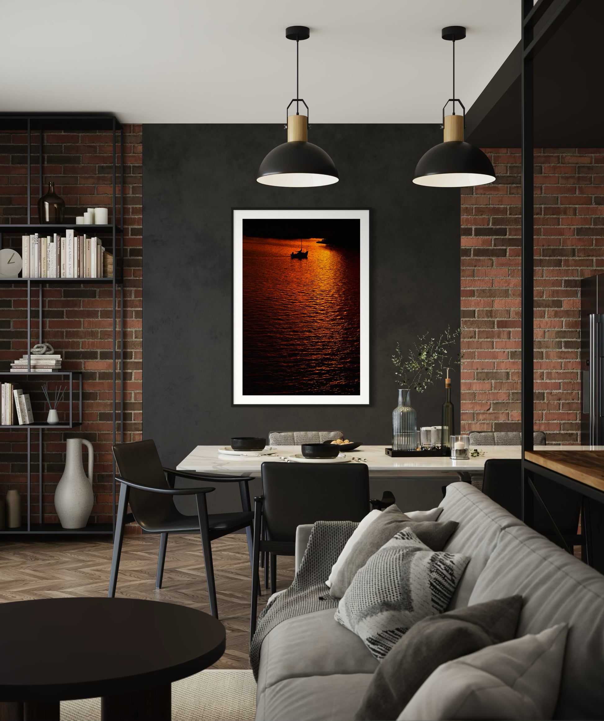 photo of sailboat sailing at sunset, in a very warm tone in black frame with white matte on black wall above in rustic retro office