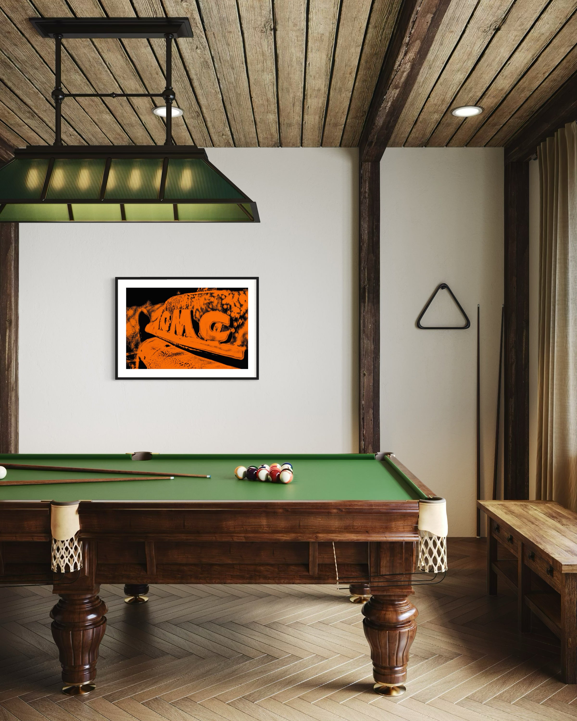 orange tone photo of front of old truck grill in black frame with white matte on off white wall in residential game room with pool table