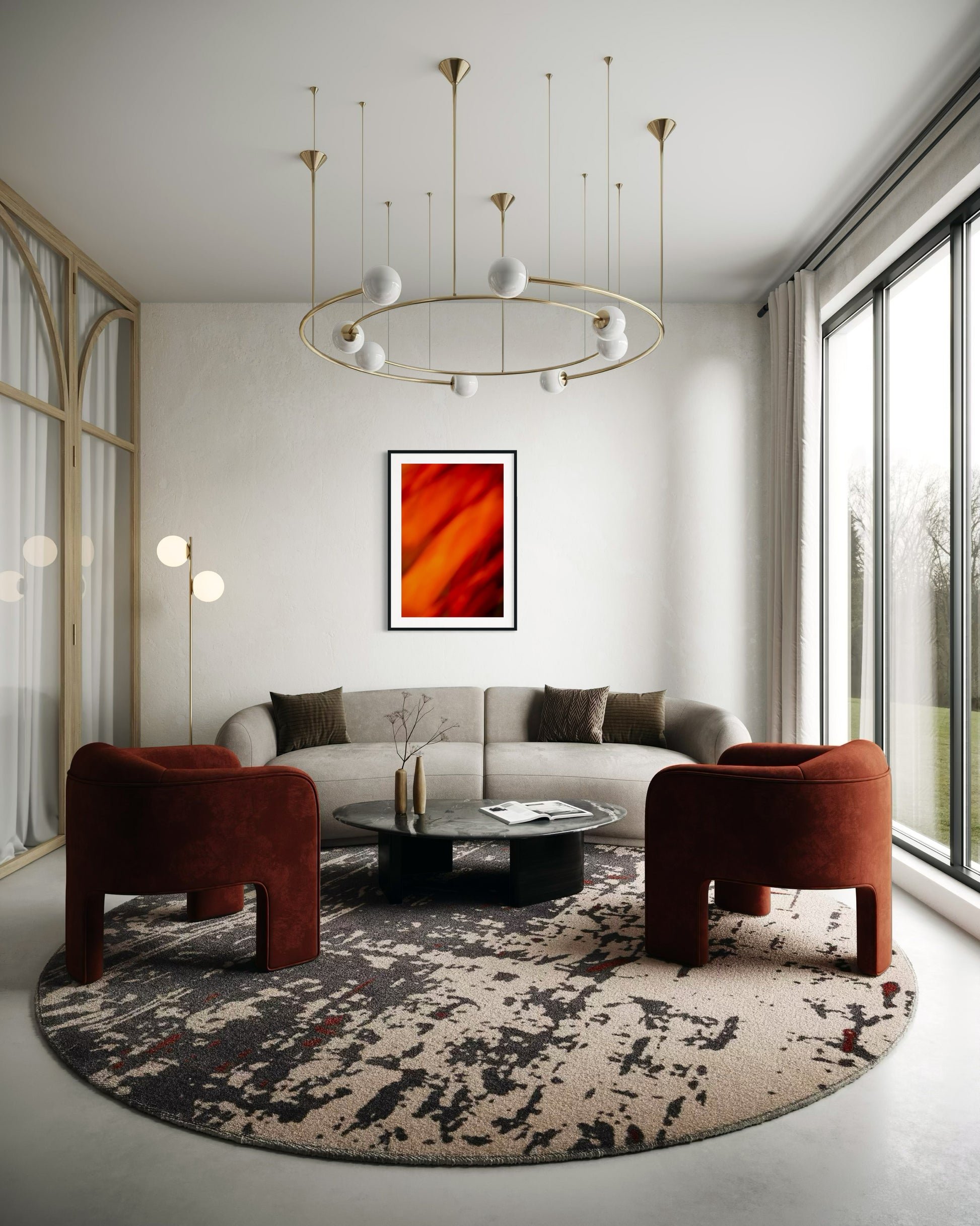 orange abstract with upward motion in black frame with white matte on off white wall in small modern living room with gray couch and two orange chairs on round abstract rug