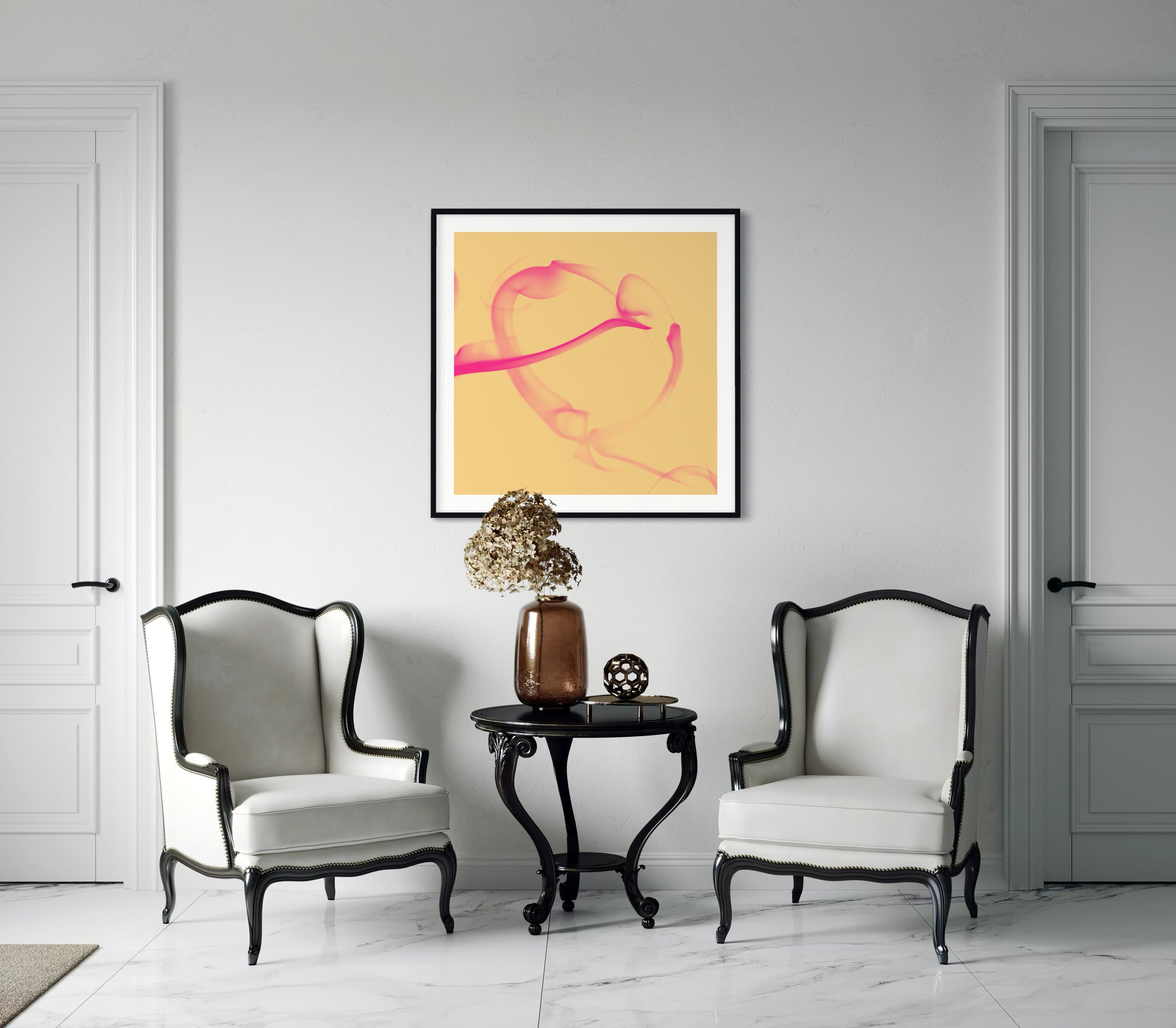abstract pink heart in black frame with white matte on light gray wall in modern gray tone sitting area