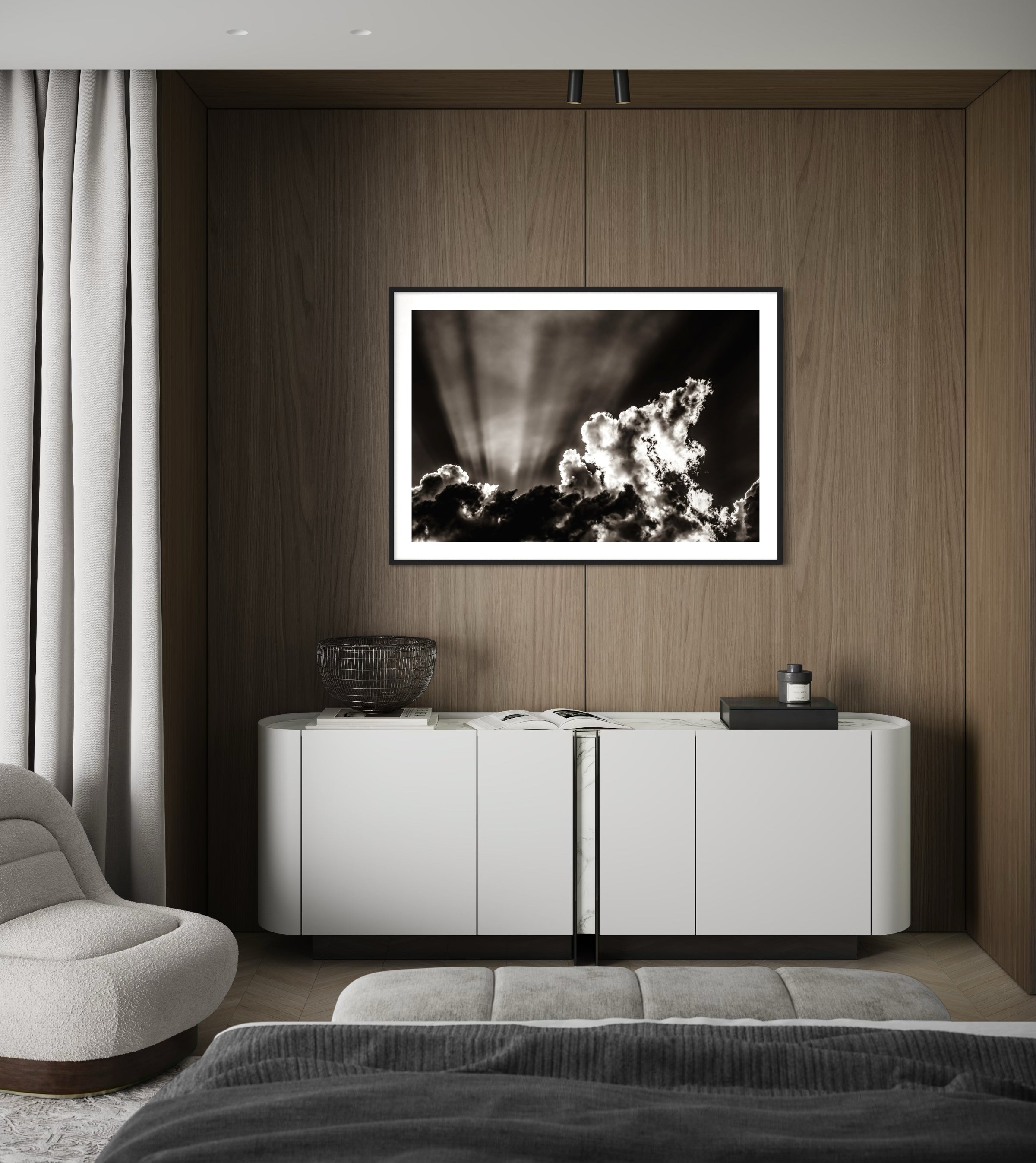 Modern living room with a white sideboard, gray sofa, and framed black and white artwork on a wooden wall.