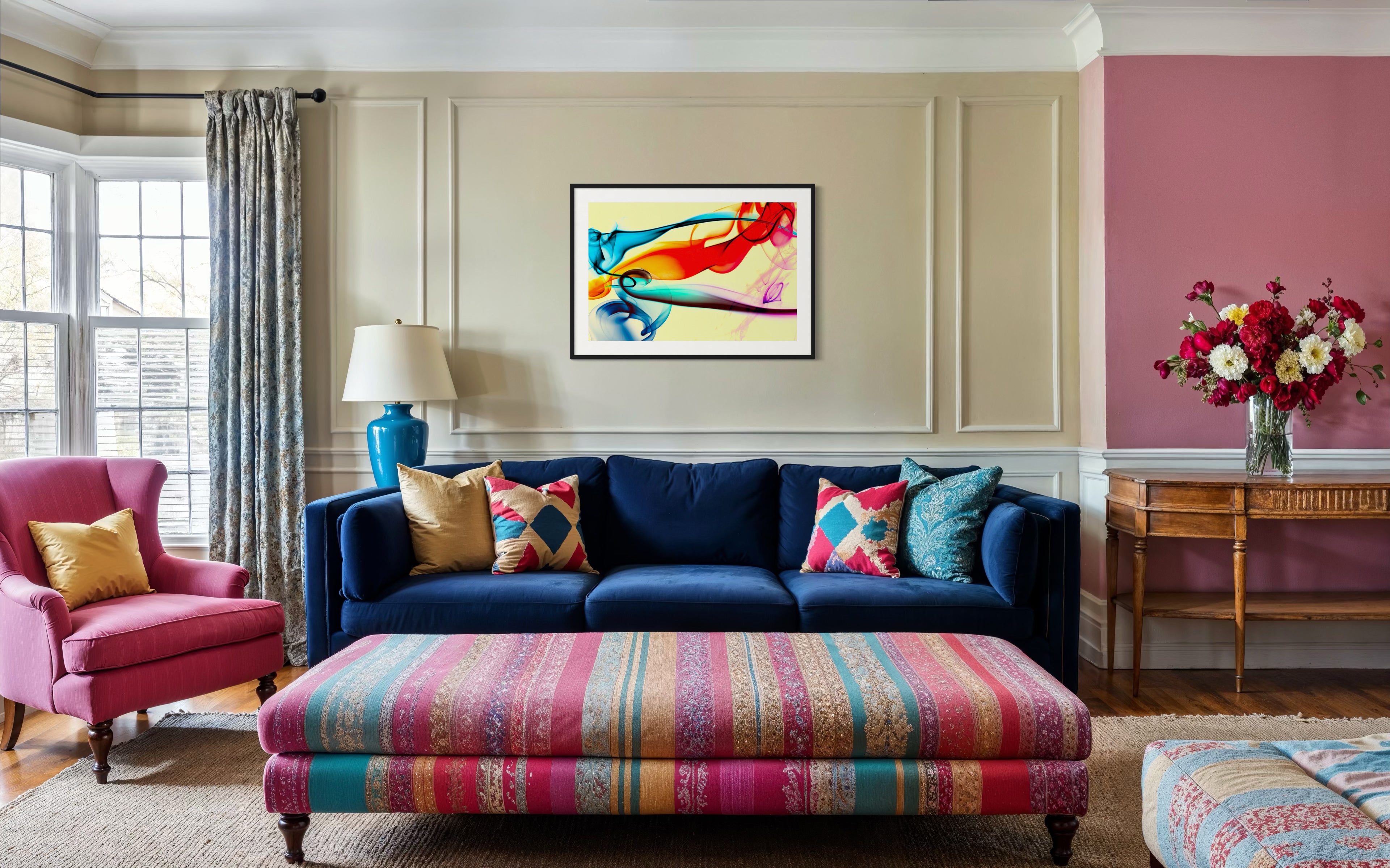 Living room with a blue sofa, colorful ottoman, and decorative pillows.