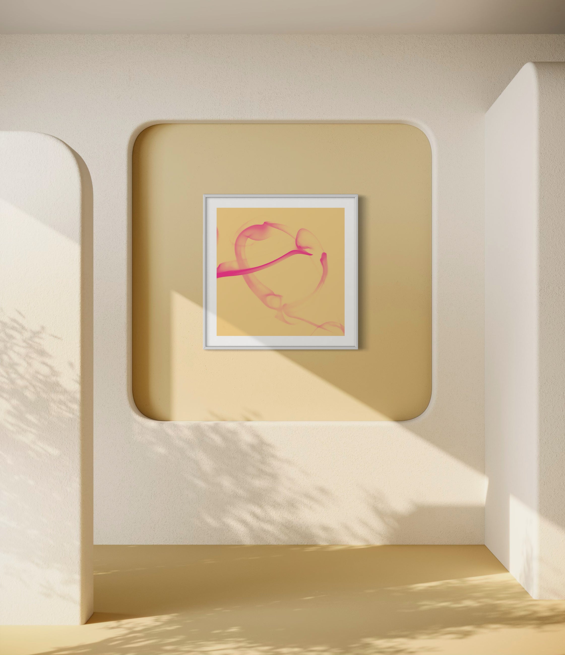 Framed abstract art piece on a beige wall with soft shadows