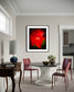 Dining room with a modern table and chairs, a lamp, and a framed abstract artwork on the wall.