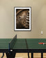 Framed photograph on a wall above a ping pong table