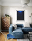 sci fi space looking photo as if close to the exterior of a space ship, blue tone, in black frame with white matte on off white wall in eclectic rustic living room 